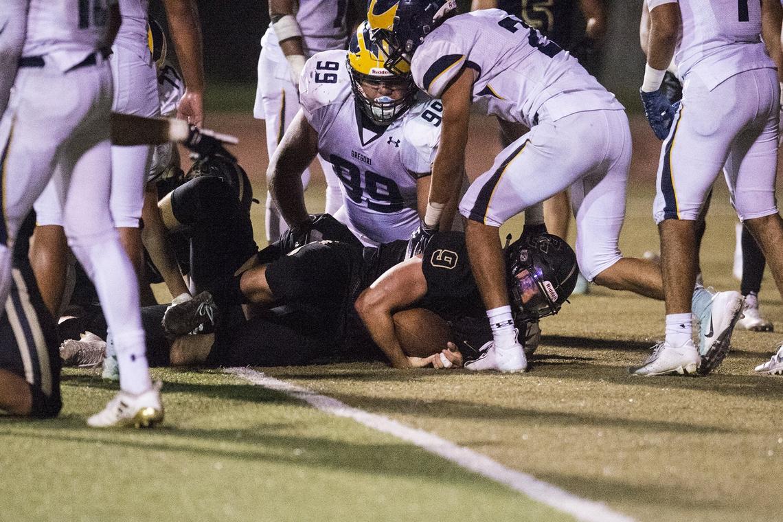 Buhach Colony senior Jon Buttrey (9) punches the ball in the end zone for the Thunder’s second touchdown of the game against Gregori at Atwater High School in Atwater, Calif., on Friday, Aug. 17, 2018. The Thunder beat the Jaguars 13-6.