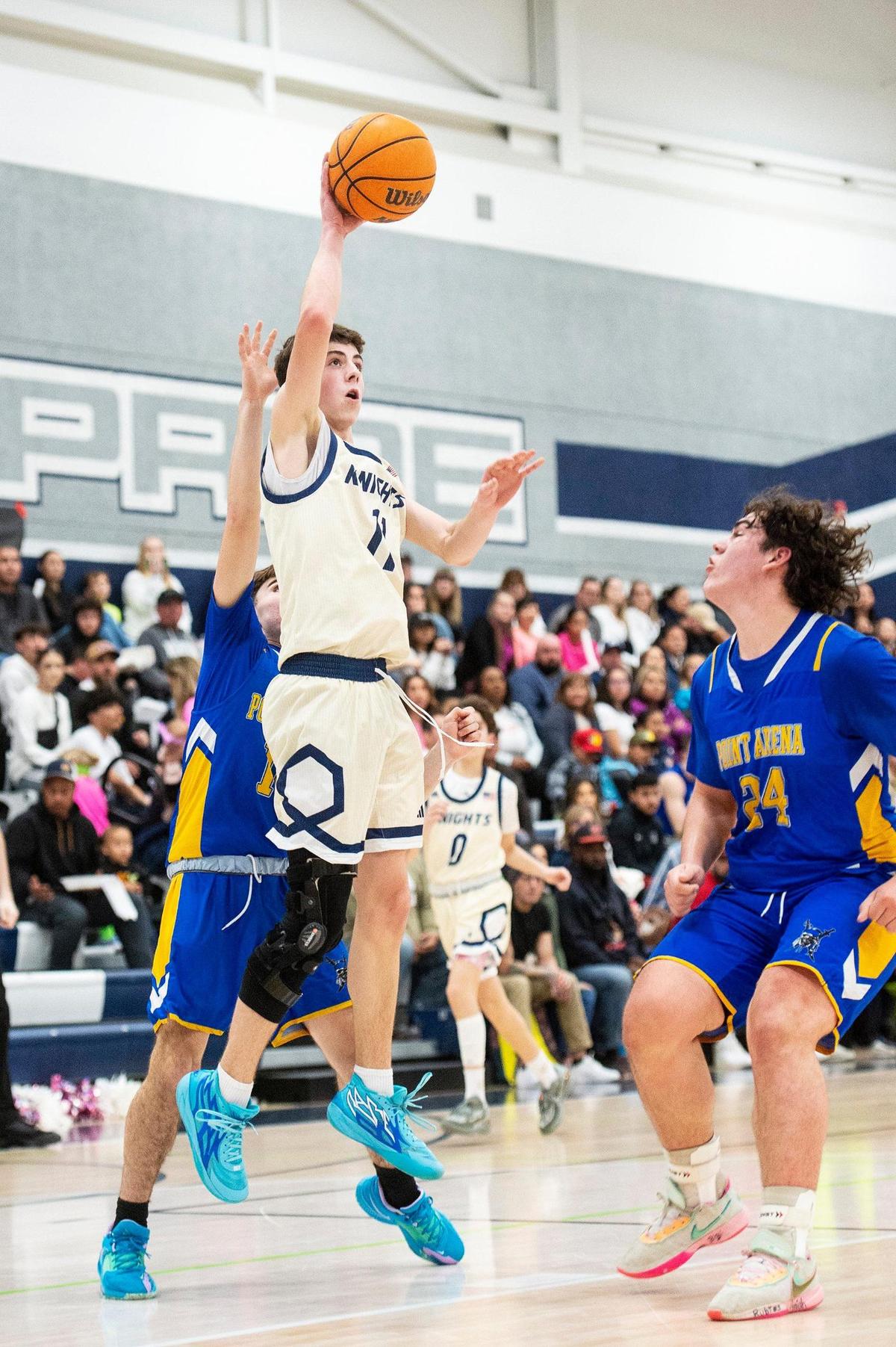 Stone Ridge Christian sophomore Cooper Trost (11) attempts a short jump shot during a NorCal Regional playoff game against Point Arena at Stone Ridge Christian High School in Merced, Calif., on Wednesday, Feb. 28, 2024. The Knights beat the Pirates 78-67.