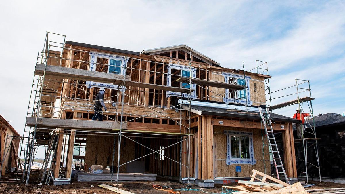 Construction crews work to build new homes on Freemark Avenue in The Meadows at Bellevue Ranch West neighborhood in Merced, Calif., on Friday, Jan. 11, 2019.
