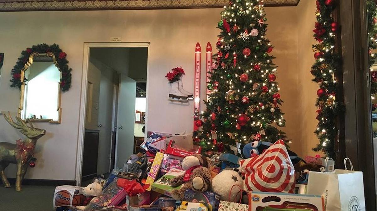 A pile of toys donated by the community under a Christmas tree at the Merced Golf and Country Club for the annual Fireman Cops for Kids toy drive on Dec. 1, 2016.