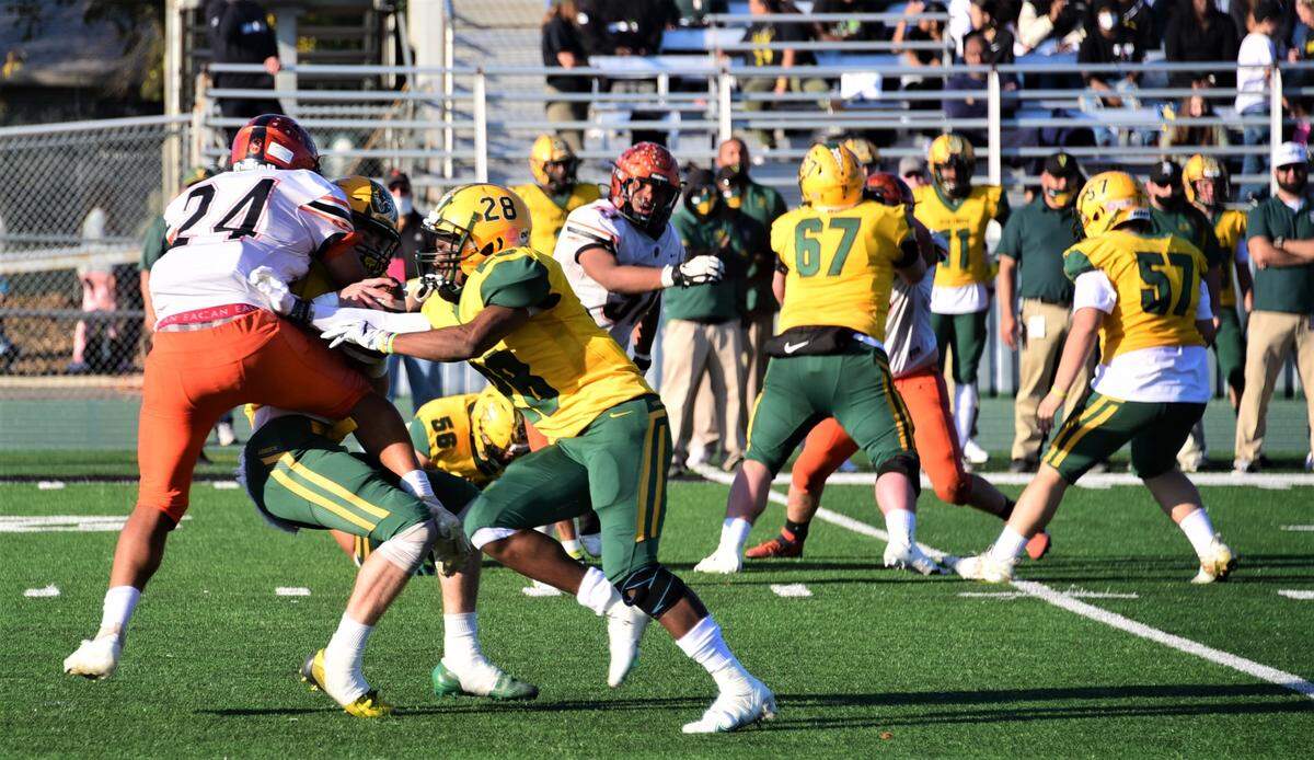 Merced High defensive end Malaki Leach sacks Vanden quarterback Tre Dimes during Merced’s 49-21 loss in the Sac-Joaquin Section Division IV championship game at St. Mary’s High School in Stockton, Calif. on Saturday, Nov. 27, 2021.