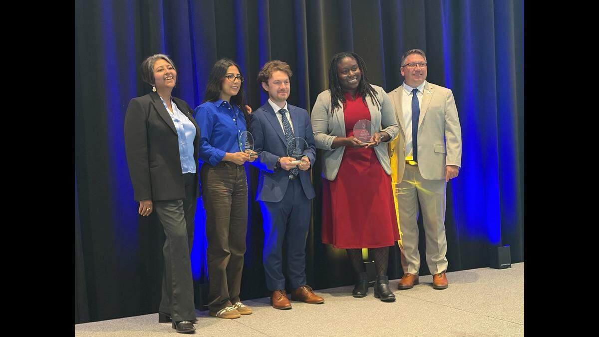 UC Merced’s Grad Slam competition was held Wednesday, March 11, 2026. From left are: Sayantani Ghosh, graduate division associate dean and professor; Zahra Alitaneh, third-place finisher; Zachary Malone, second place; Tahirah Williams, champion; and Hrant Hratchian, graduate division vice provost, dean of graduate education and professor.