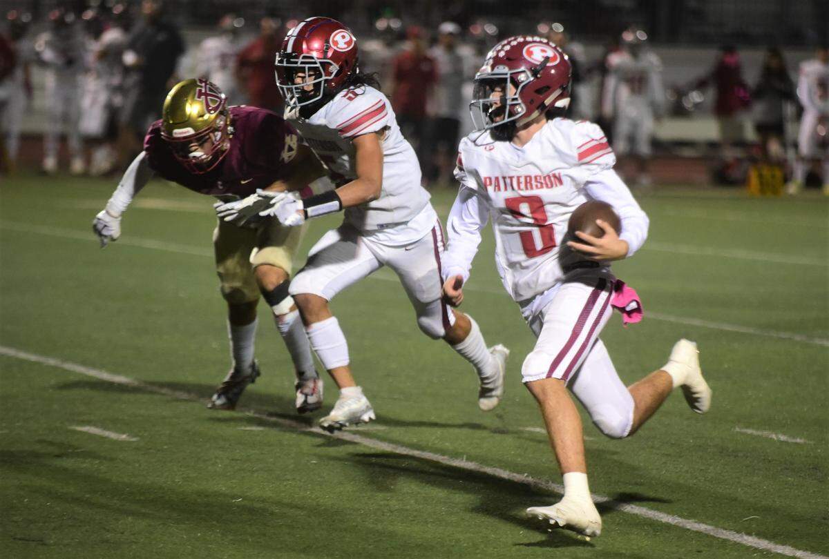 Patterson quarterback Max Medina (3) runs the ball up field against Golden Valley on Friday, Oct. 14, 2022. Medina threw three touchdowns in the Tiges’ 35-13 win.