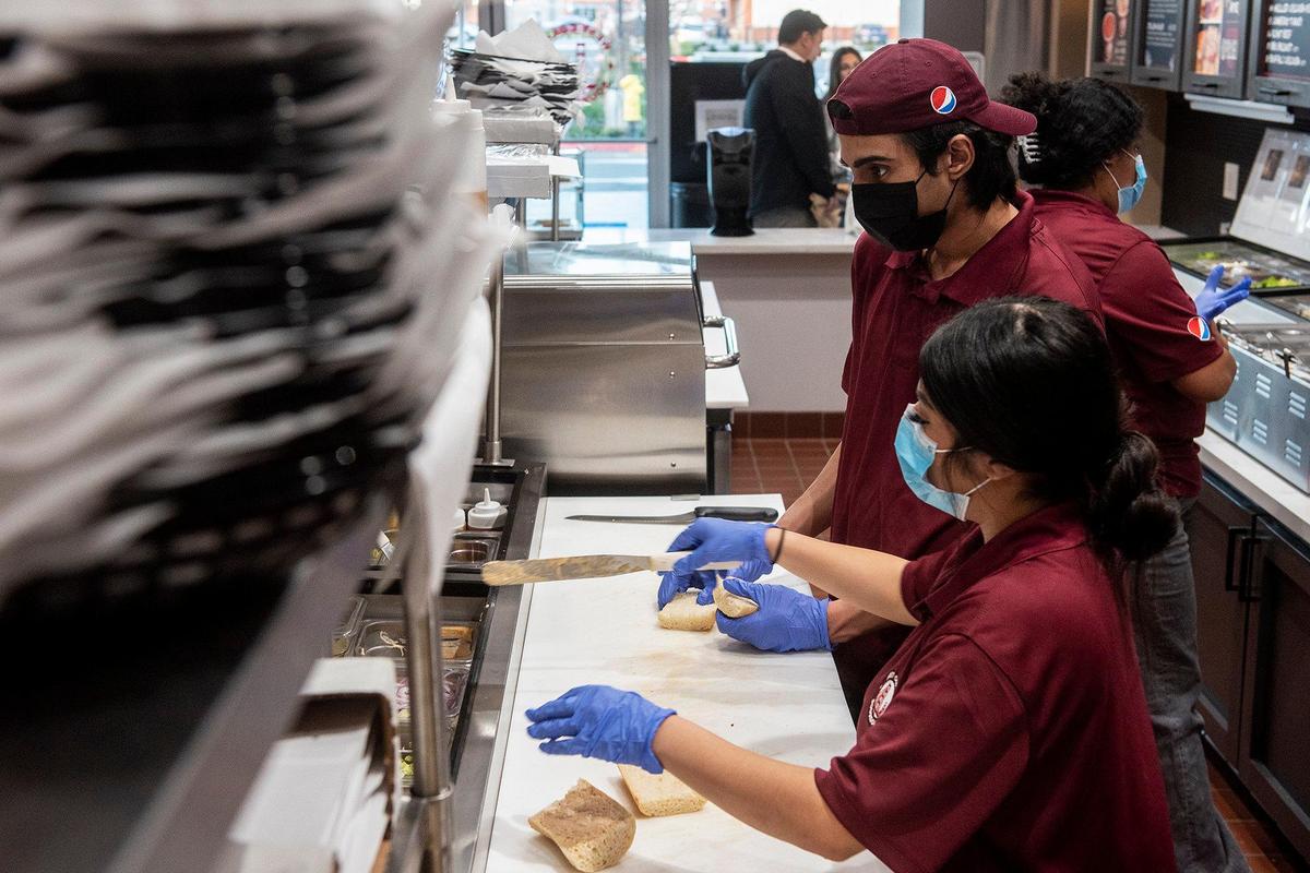 Employees P.J. Shergill, 17, and Vivica Avina, 19, make sandwiches while fulfilling orders at West Coast Sourdough located at 125 E. Yosemite Ave Suite C, in Merced, Calif., on Thursday, Jan 19, 2023.