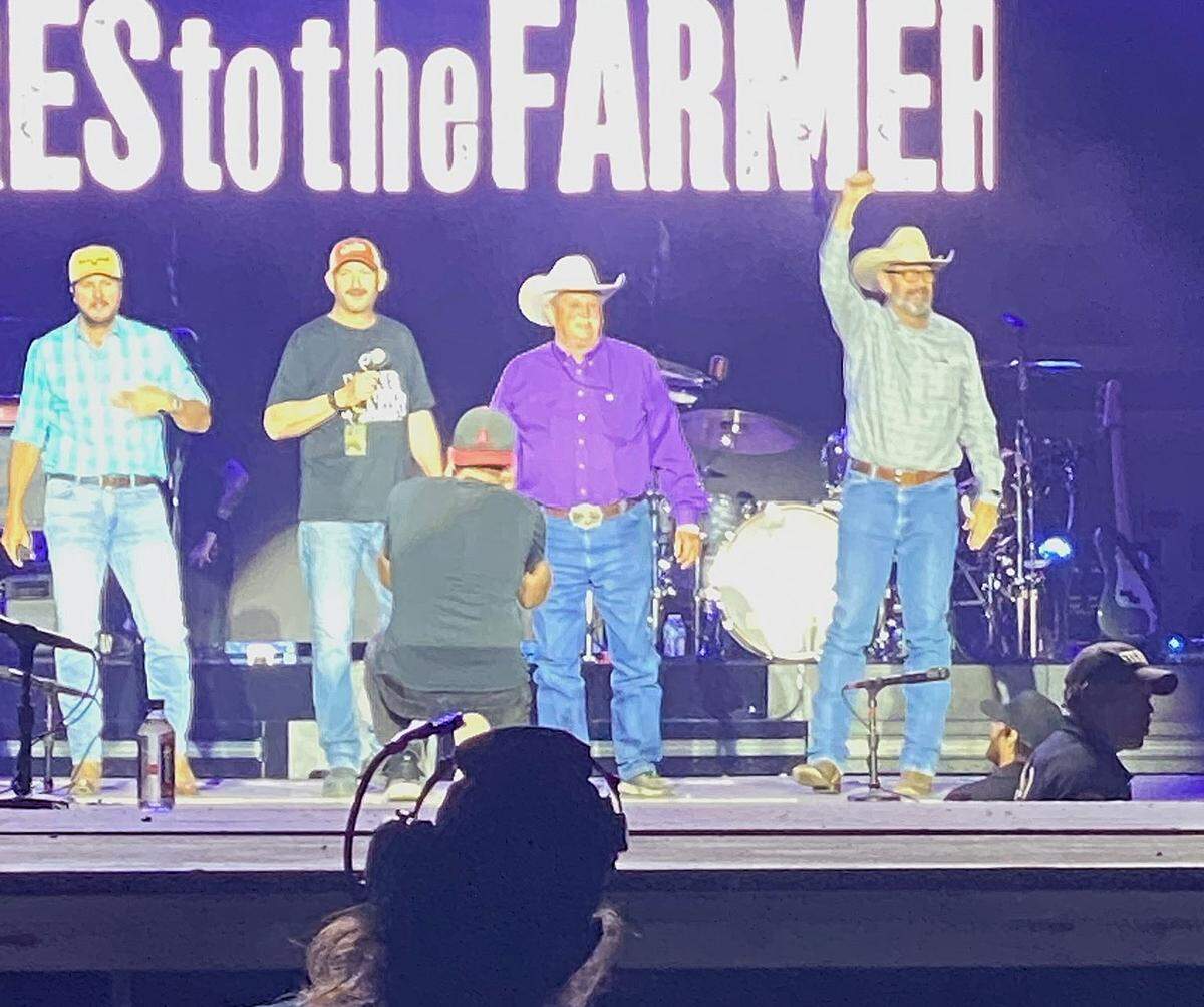 Merced County Supervisor Daron McDaniel is pictured on stage during Luke Bryan’s Farm Tour 25 performance at Castle Airport with Bryan, left, on Thursday, May 15, 2025.