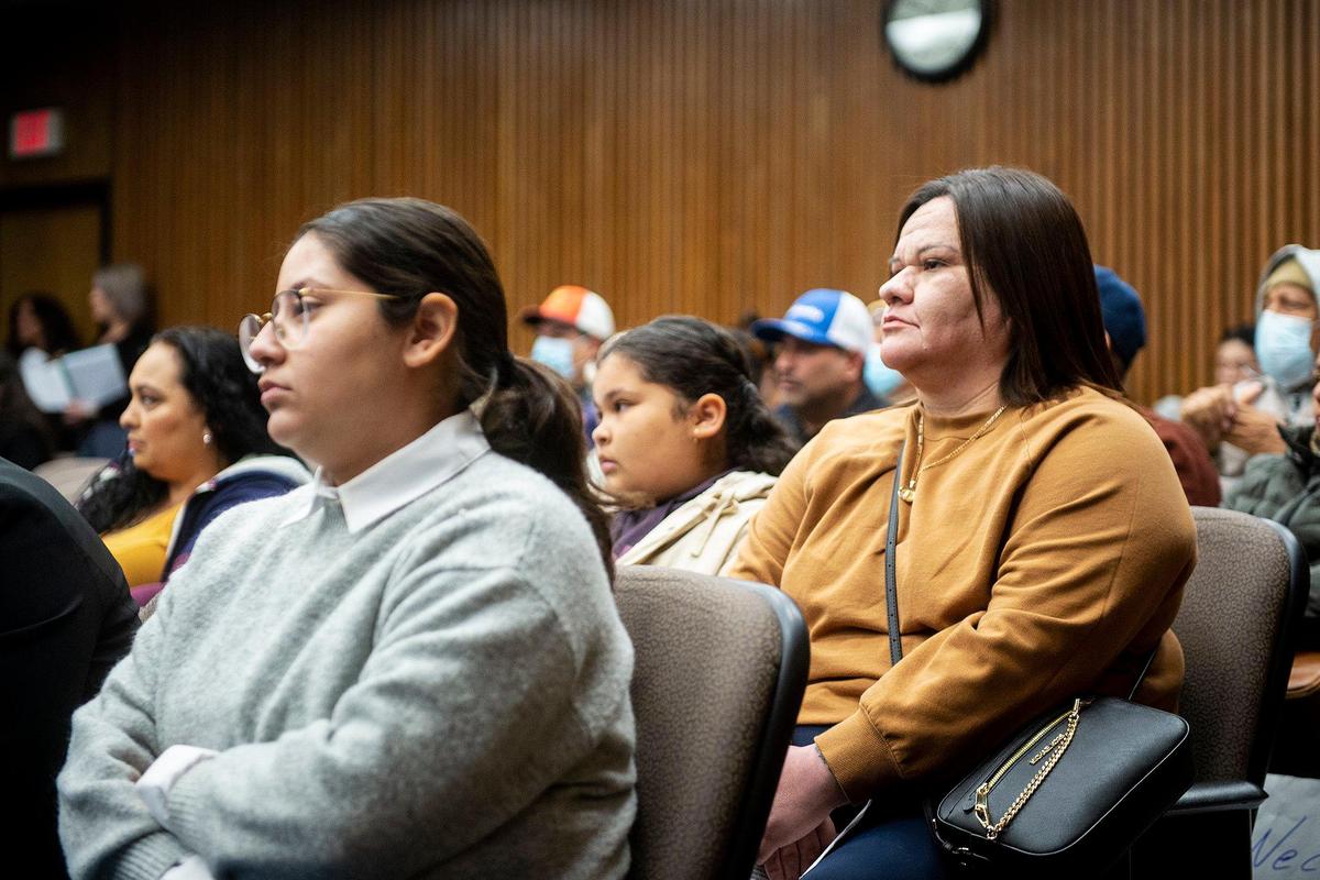 Maria Nava, 37, of Planada, right, looks on during the Merced County Board of Supervisors meeting in Merced, Calif., on Tuesday, Feb. 28, 2023. Nava, as well as other Planada residents and community advocates spoke during the meeting and said the county isn’t doing enough to help the community of Planada following devastating flooding which damaged homes and forced thousands to evacuate.
