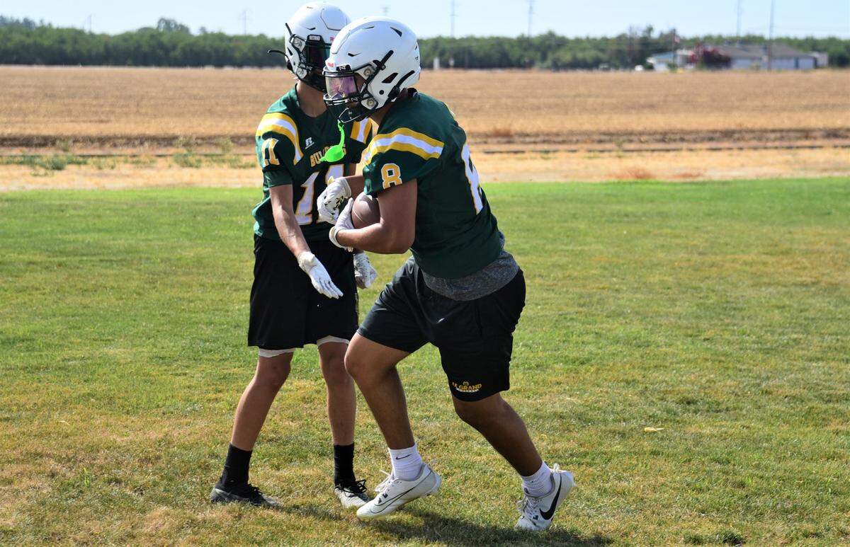 Le Grand High School senior Reyes Diaz (5) hauls in a pass during practice on Thursday, Aug. 10, 2023.