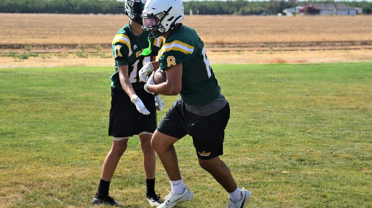 Le Grand High School senior Reyes Diaz (5) hauls in a pass during practice on Thursday, Aug. 10, 2023.