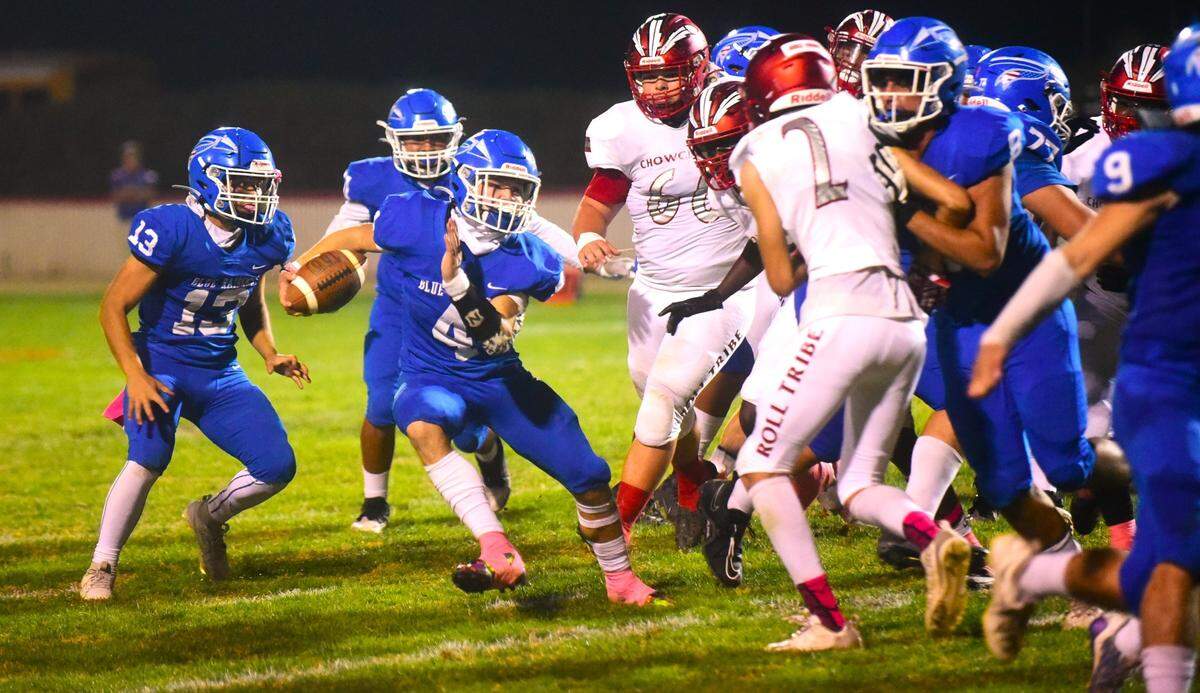 Caruthers High School senior Hunter Babb (4) runs the ball against Chowchilla during a game on Friday, Oct. 20 2023. Babb led the nation in rushing coming into Friday’s game.