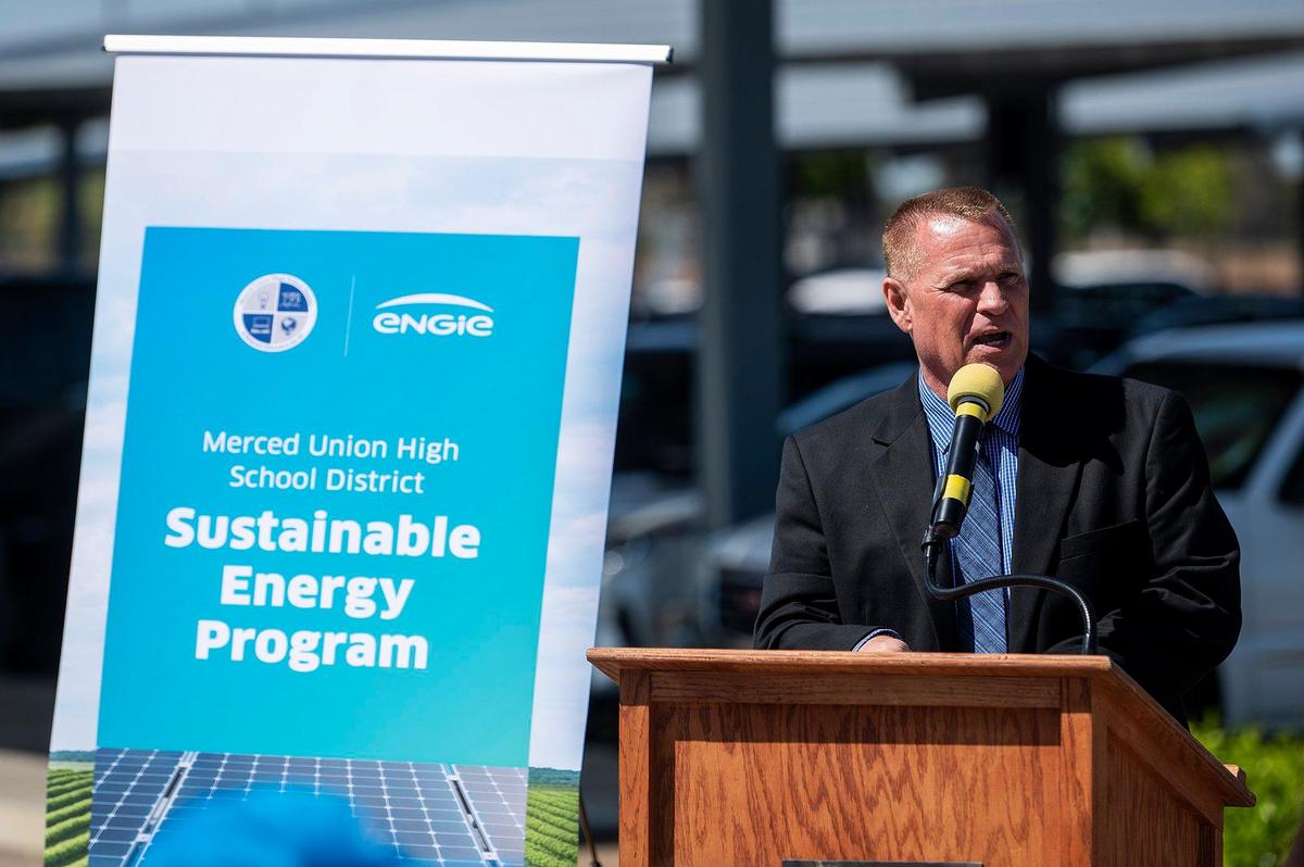 El Capitan High School Principal Lee Shaw, speaks during a ceremony celebrating a Merced Union High School District’s renewable energy project at El Capitan High School in Merced, Calif., on Wednesday, April 13, 2022. Solar array structures have been installed at all Merced Union High School District parking lots and the panels are expected to supply the district with about 90% of its energy needs.