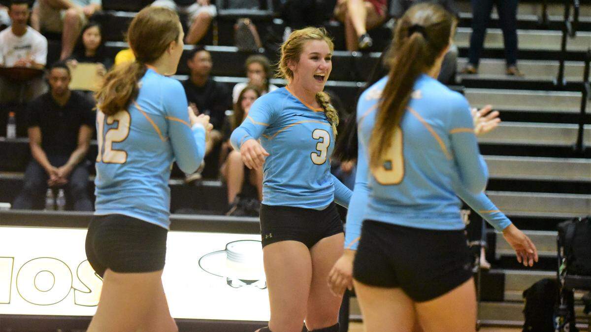 El Capitan’s Roosmarie Van Der Weide (12), Natalie Collins (3) and Sara Johnson (9) celebrate a point against Buhach Colony on Wednesday, Sept. 25, 2019.