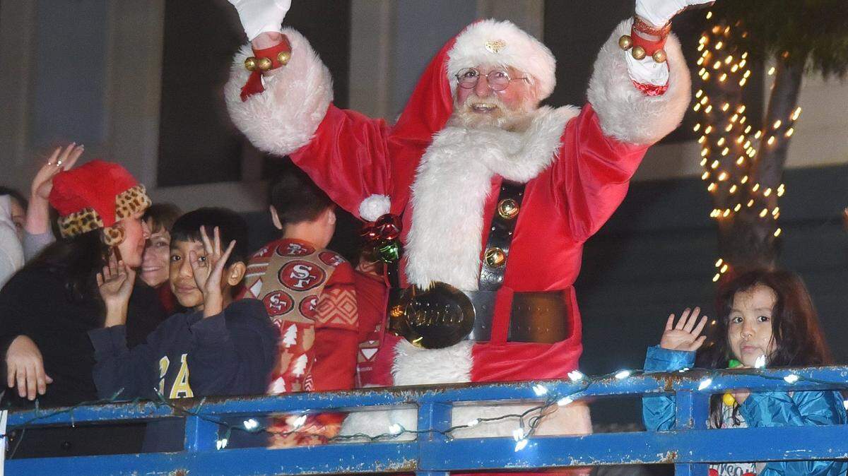 Santa is shown greets everyone Friday night, Dec. 7, 2019 during the annual Los Banos Downtown Christmas Parade.