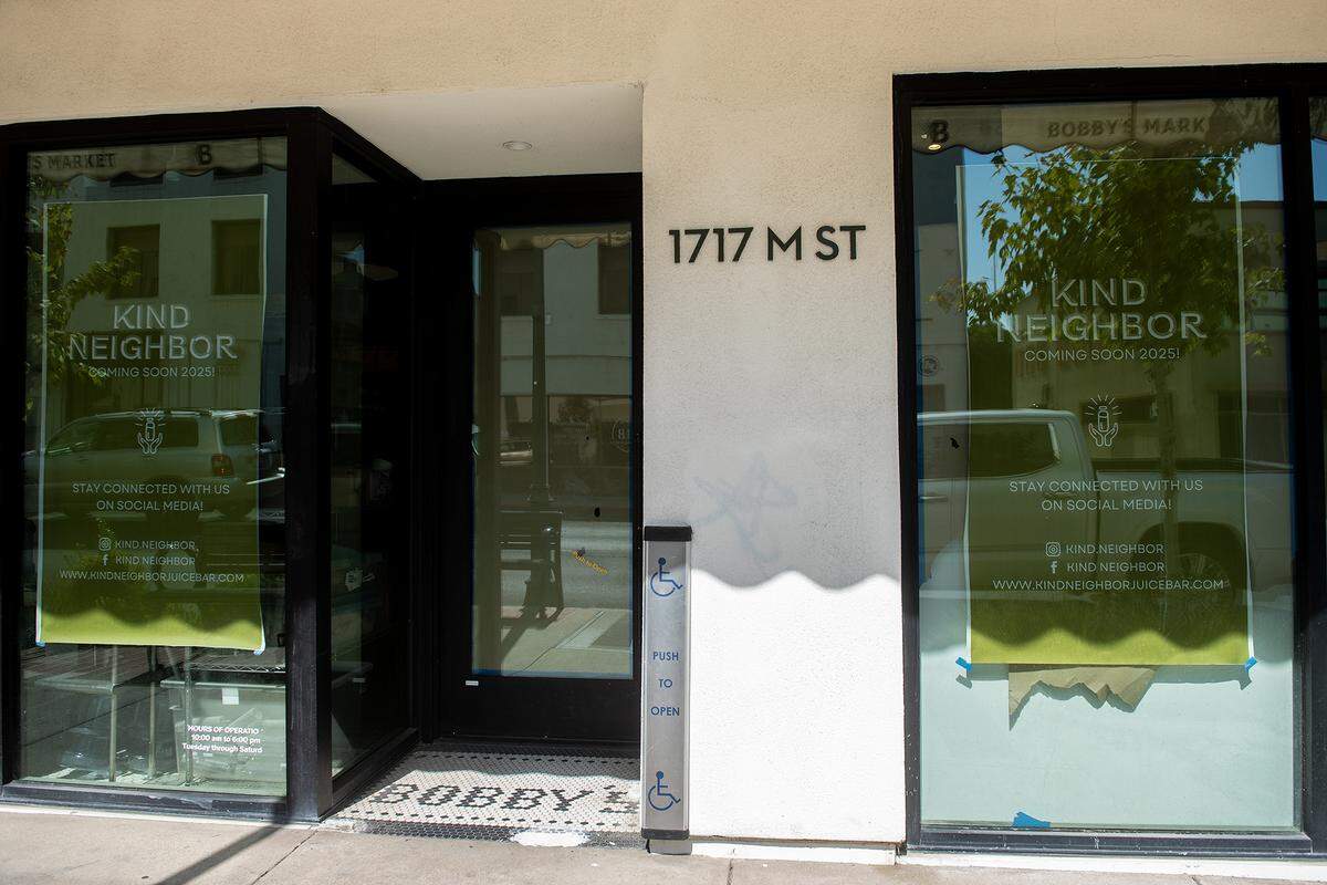 Signage for Kind Neighbor, a Merced juice bar, is seen in the windows at 1717 M Street in Merced, Calif., on Monday, Aug. 25, 2025. The juice bar will be reopening in the new location in September. 