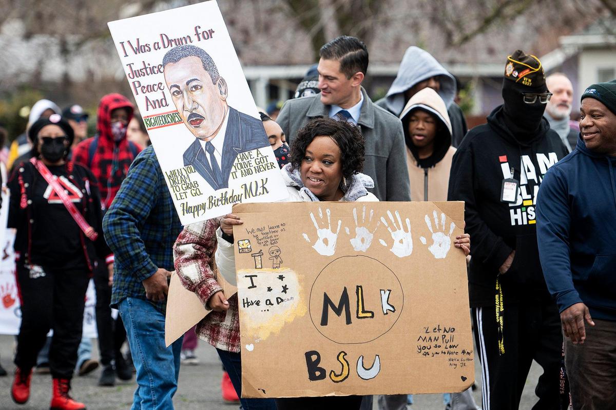 Weaver Middle School teacher and advisor of the school’s Black Student Union, Reinetta Bazemore, 46, marches during the annual Peace and Unity March to honor the legacy of late civil rights leader Rev. Dr. Martin Luther King Jr. in Merced, Calif., on Monday, Jan 15, 2024.