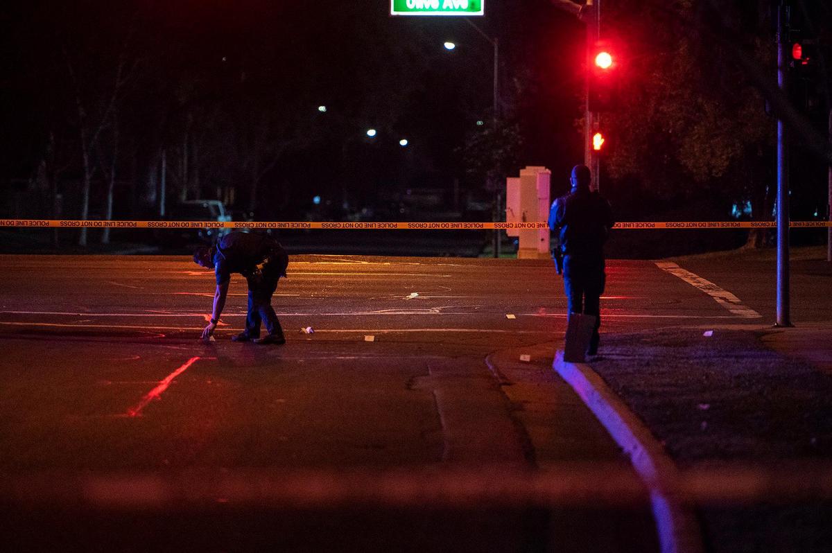 Merced police investigate the scene of shooting near the intersection of Olive Avenue and Meadows Avenue in Merced, Calif., on Tuesday, Feb. 8, 2022. According to police, an adult male gunshot victim suffering from at least one gunshot wound was located in the 600 block of Loughborough Drive. He was transported to a hospital for treatment of serious injuries.