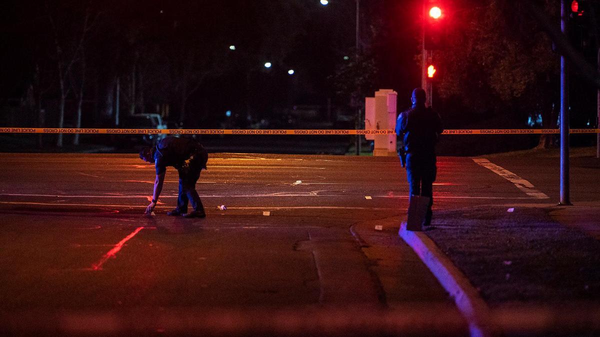 Merced police investigate the scene of shooting near the intersection of Olive Avenue and Meadows Avenue in Merced, Calif., on Tuesday, Feb. 8, 2022. According to police, an adult male gunshot victim suffering from at least one gunshot wound was located in the 600 block of Loughborough Drive. He was transported to a hospital for treatment of serious injuries.