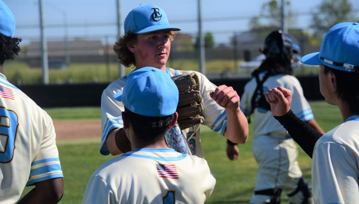 El Capitan High School pitcher Andrew Bakken is greeted by teammates after pitchign a scoreless second inning during an 11-0 win over Escalon on Thursday, April 27, 2023 at El Capitan High School.