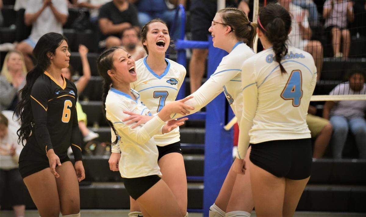 El Capitan High volleyball players celebrate a point during a match against Golden Valley on Wednesday, Sept. 21, 2022 at El Capitan High School.