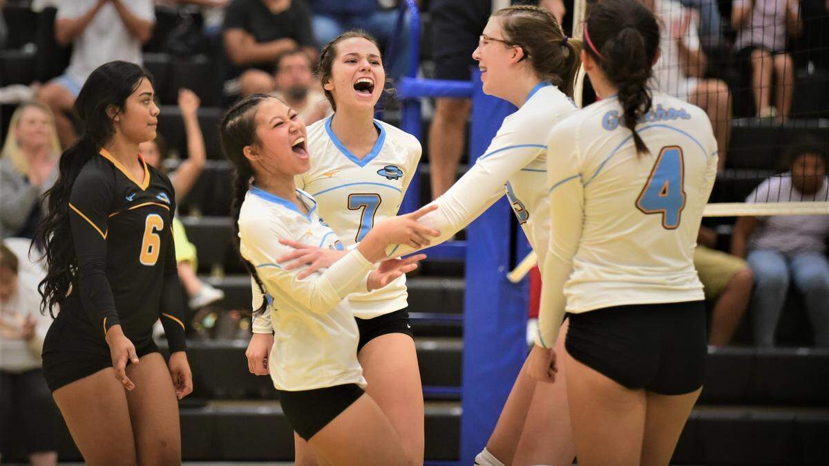 El Capitan High volleyball players celebrate a point during a match against Golden Valley on Wednesday, Sept. 21, 2022 at El Capitan High School.