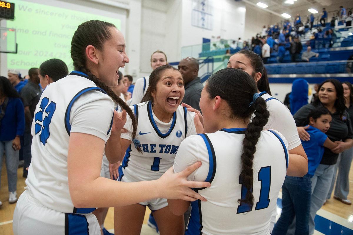 The Atwater Falcons celebrate a 70-54 win over the Grant Pacers at Atwater High School in Atwater, Calif., on Tuesday, Feb. 25, 2025.