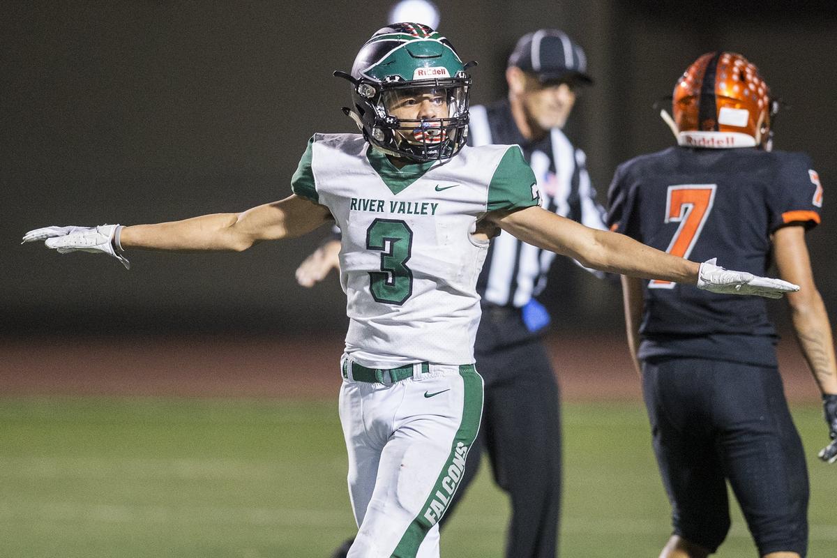 River Valley senior Isayah Osborne (3) signals for an incomplete pass after breaking up a Merced passing play during a CIF Sac-Joaquin Section Division III playoff game at Veterans Stadium in Merced, Calif., on Friday, Nov. 9, 2018. The Falcons beat the Bears 45-40.