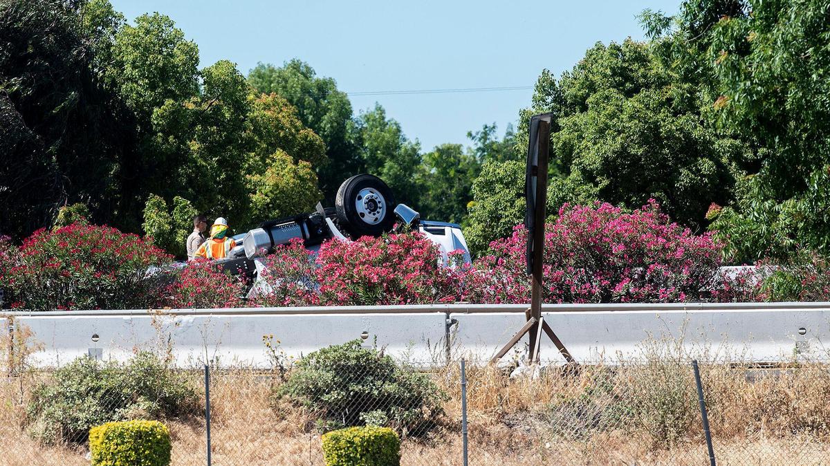 The number one northbound lane of Highway 99 comes to a standstill, as the California Highway Patrol responds to the scene of an overturned big rig just north of V Street, in Merced, Calif., on Monday, June 6, 2022.