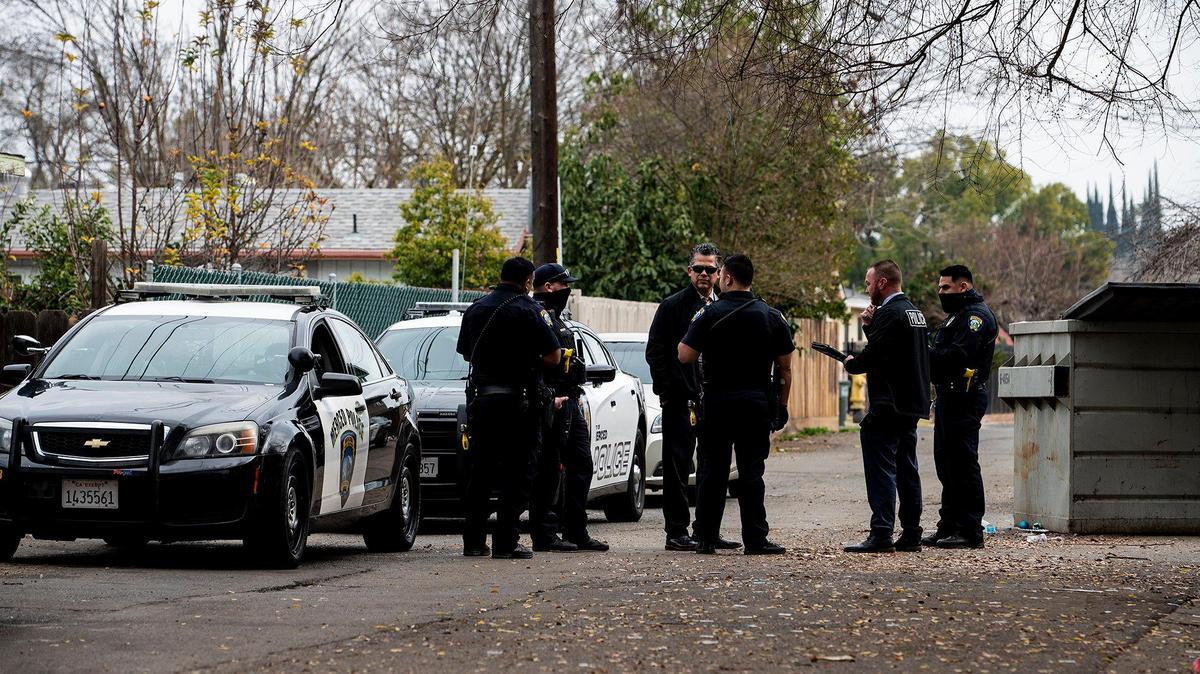 Merced police officers and detectives investigate the scene of an alleged assault with a deadly weapon after a man was reportedly run over by a vehicle in the 800 block of West Santa Fe Avenue between O and P streets in Merced, Calif., on Thursday, Jan. 6, 2022. According to Lt. Emily Foster, the man was flown to a regional hospital with serious injuries.