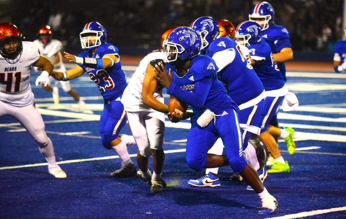 Atwater High School quarterback AJ Banks (4) runs the ball against Merced during Santa Fe Bowl 53 on Friday, Sept. 22, 2023 at Dave Honey Stadium in Atwater, Calif.