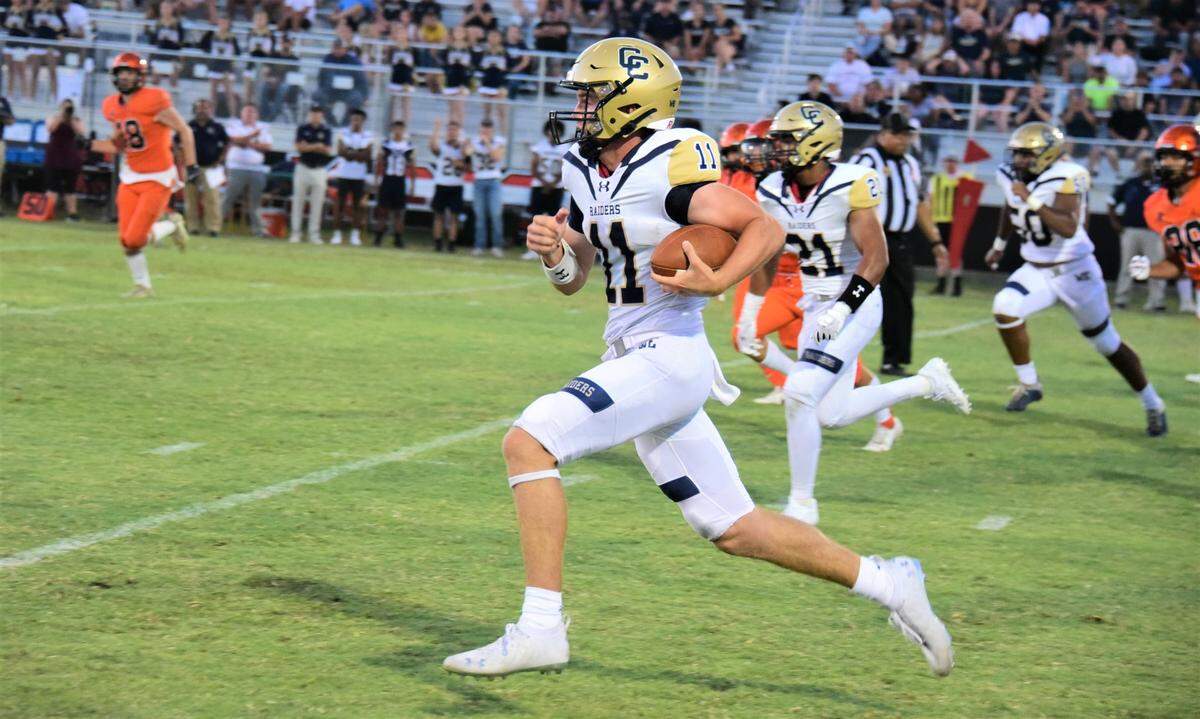 Central Catholic quarterback TP Wentworth runs down field during a game against Merced on Friday, Aug. 19, 2022.