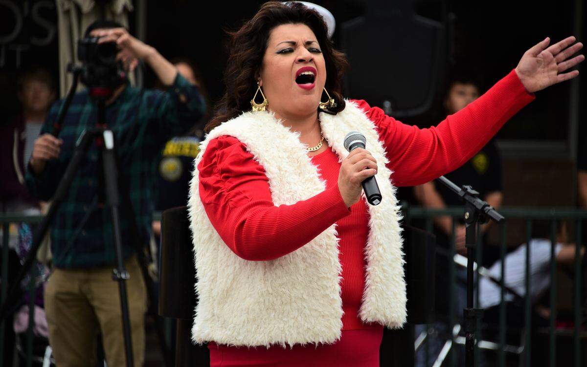 Martha Armas sings “America The Beautiful” during the opening ceremonies of the Merced Veterans Day Parade on Thursday, Nov. 11, 2021, at Bob Hart Square in downtown Merced.