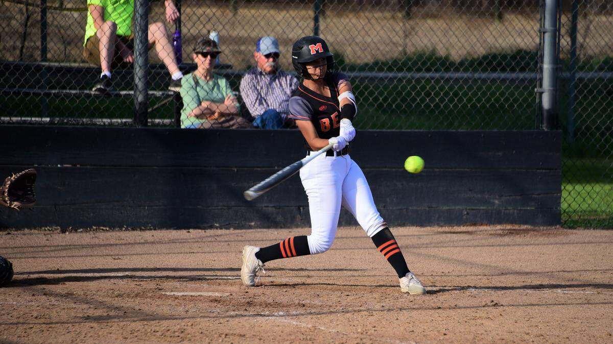 Merced High senior Elysa Walker lines a single during a game against Hughson on Wednesday, March 11, 2020 at Merced High School.
