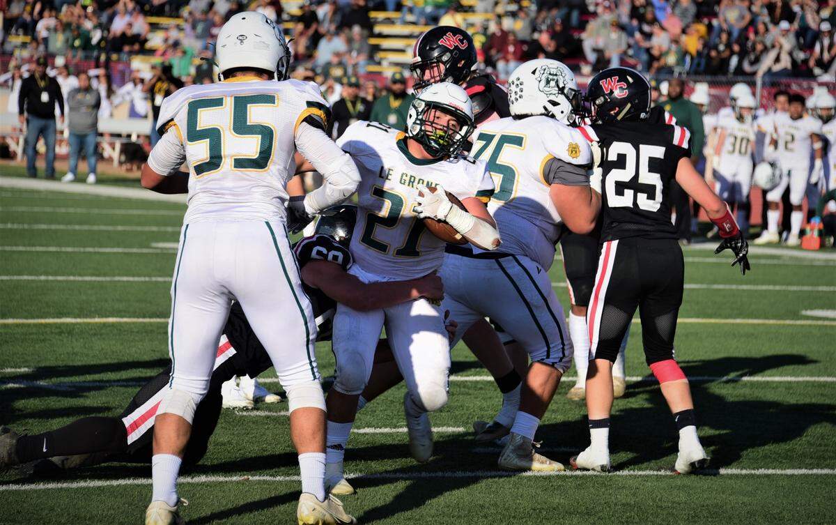 Le Grand High running back Louie Aguallo scores a touchdown during Le Grand’s 35-12 win over Woodland Christian in the Sac-Joaquin Section Division VII championship game at Hughes Stadium in Sacramento, Calif.