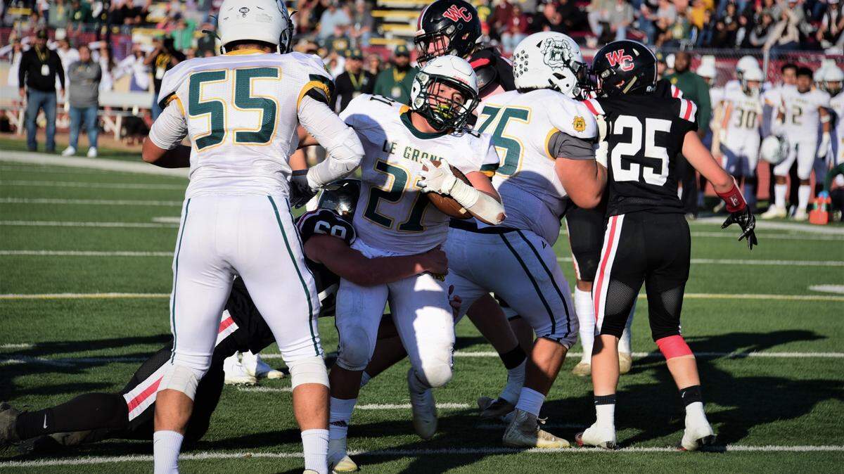 Le Grand High running back Louie Aguallo scores a touchdown during Le Grand’s 35-12 win over Woodland Christian in the Sac-Joaquin Section Division VII championship game at Hughes Stadium in Sacramento, Calif.