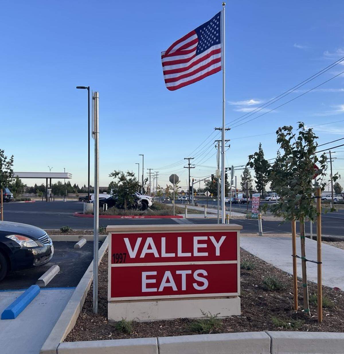 A sign reading Valley Eats.