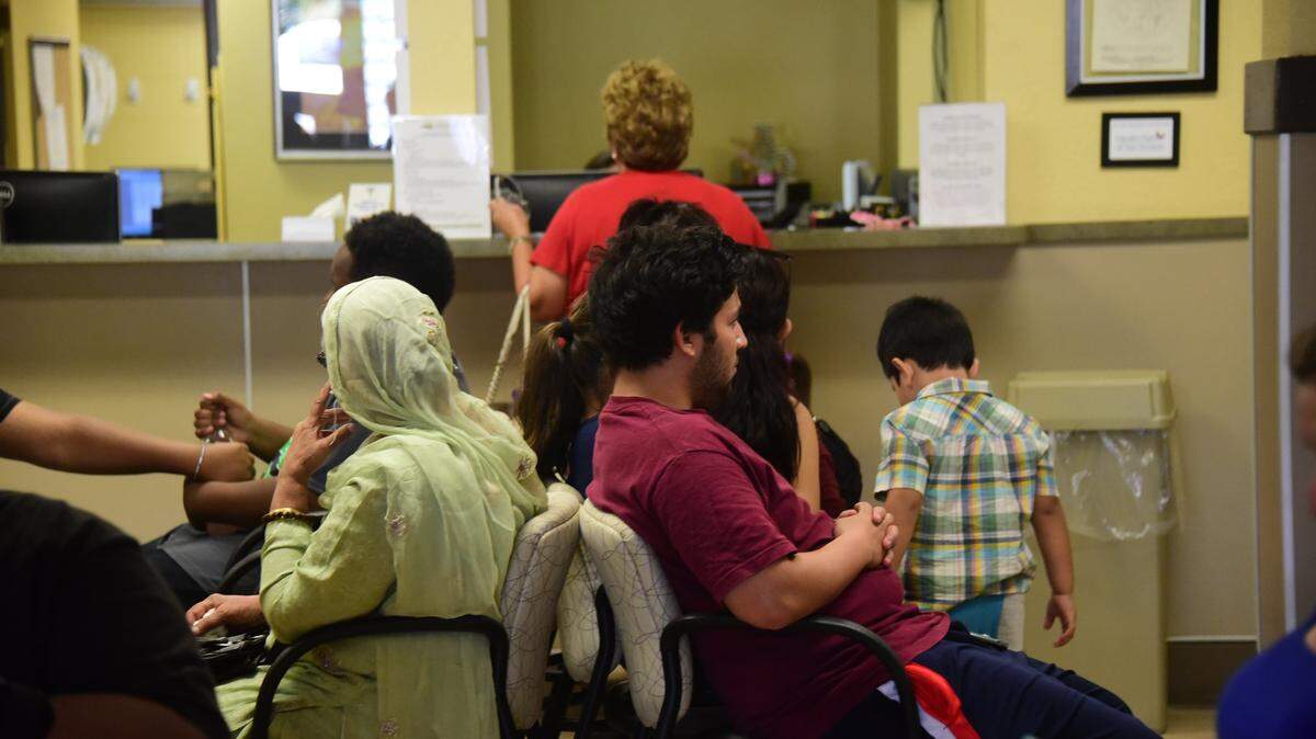 Patients awaiting their doctors appointments in the waiting room of a Livingston Community Health clinic in Livingston on Aug. 31, 2017.