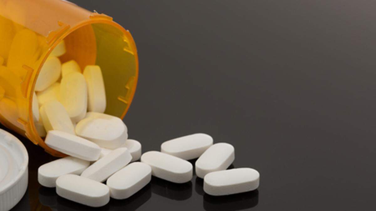 Pills spilled out on table (Dreamstime/TNS)