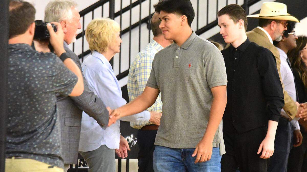 Atwater High School senior Gabriel Cisneros shakes hands with local dignitaries before making his way on stage with the other future Marine enlistees during the Merced Union High School District’s second Salute to Service Luncheon on Tuesday, May 13, 2025 at Merced High School.