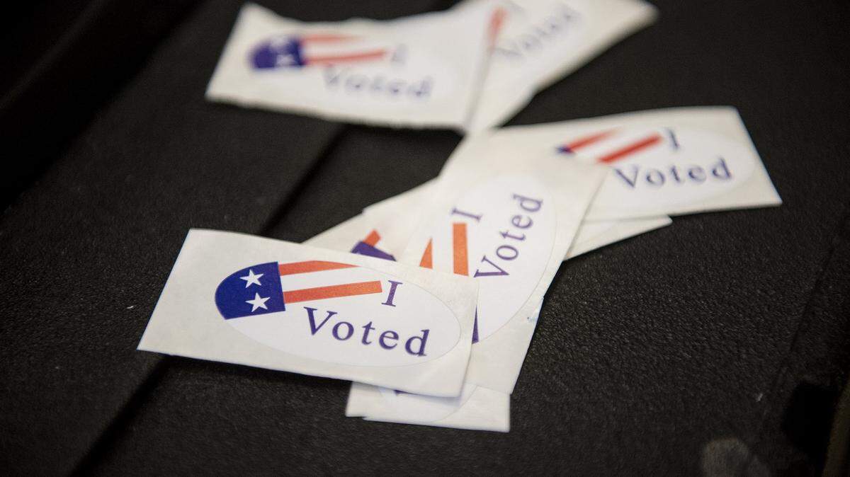 Stickers wait to be handed out to voters at the Merced County Administration Building in Merced, Calif., on Tuesday, June 5, 2018.