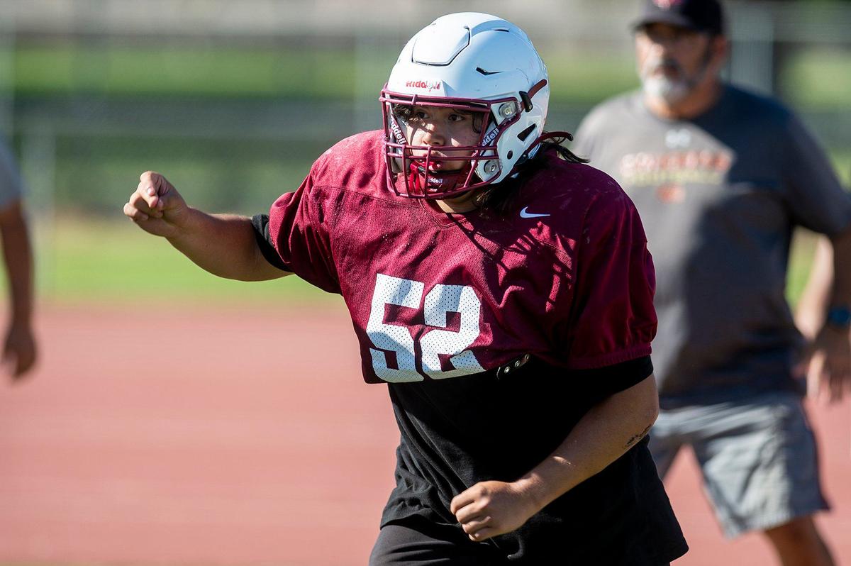 Stephen Topetillo chases down the ball carrier during football practice at Golden Valley High School in Merced, Calif., on Tuesday, Aug. 20, 2024.