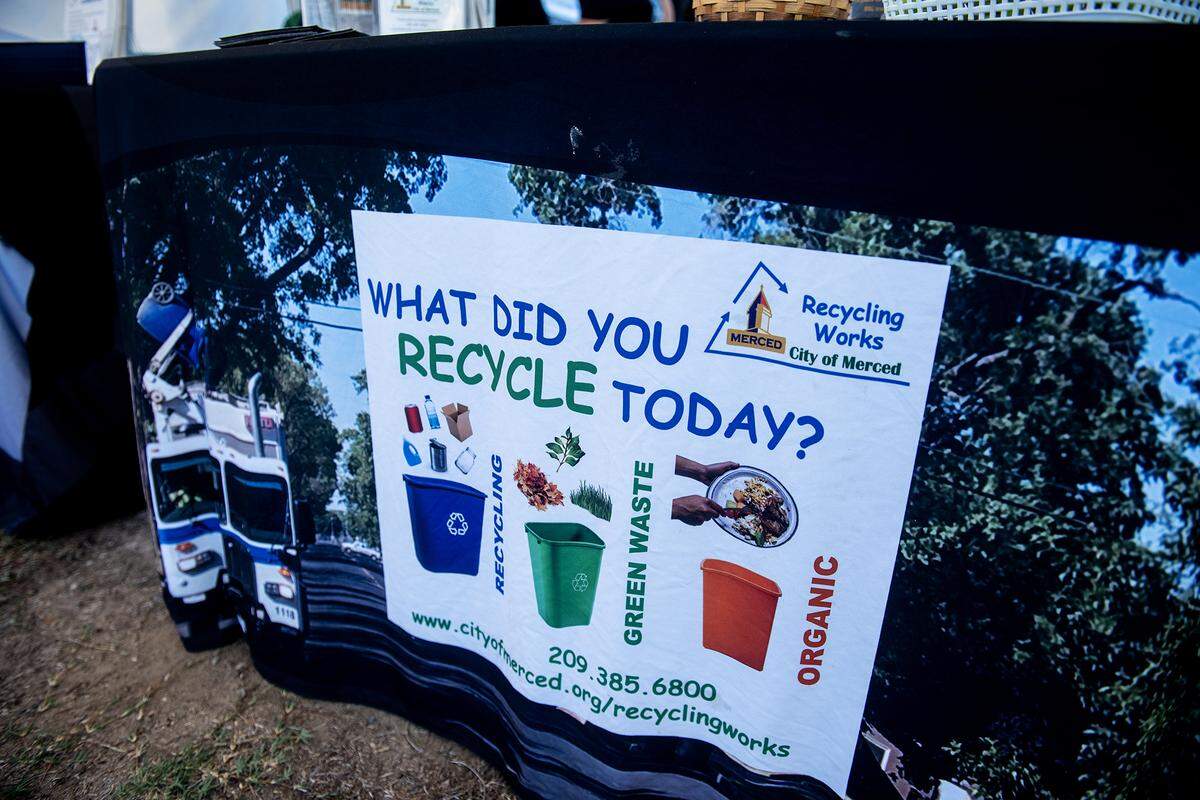 City of Merced Recycling Coordinator Monique Gama, interacts with members of the community from the city’s recycling table set up during the National Night Out event at Applegate Park in Merced, Calif., on Tuesday, Aug. 5, 2025. 