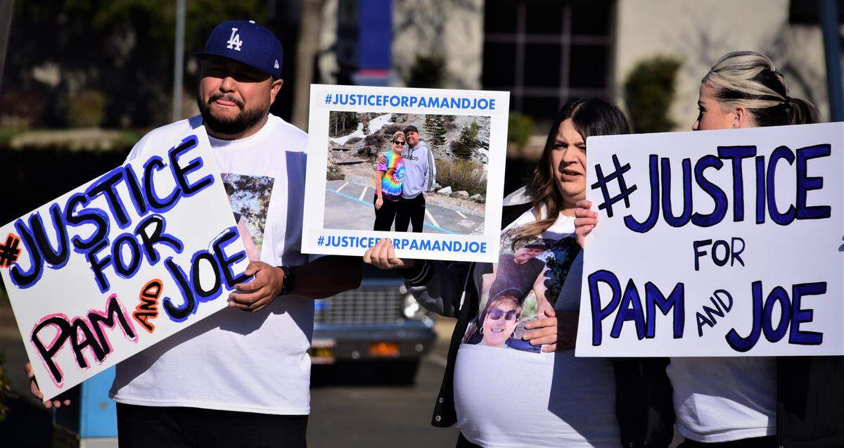 Family members and friends of Pam and Joe Juarez, held signs to remember the husband and wife who were killed in an Atwater-area crash on June 25, during a press conference held in front of Atwater City Hall on Dec. 10, 2021 in Atwater, Calif.