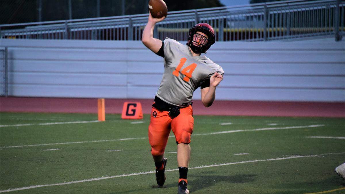 Merced senior quarterback Seth Scheidt throws a pass during a scrimmage against Clovis on Friday, Aug. 13, 2021 at Veterans Stadium in Merced, Calif.