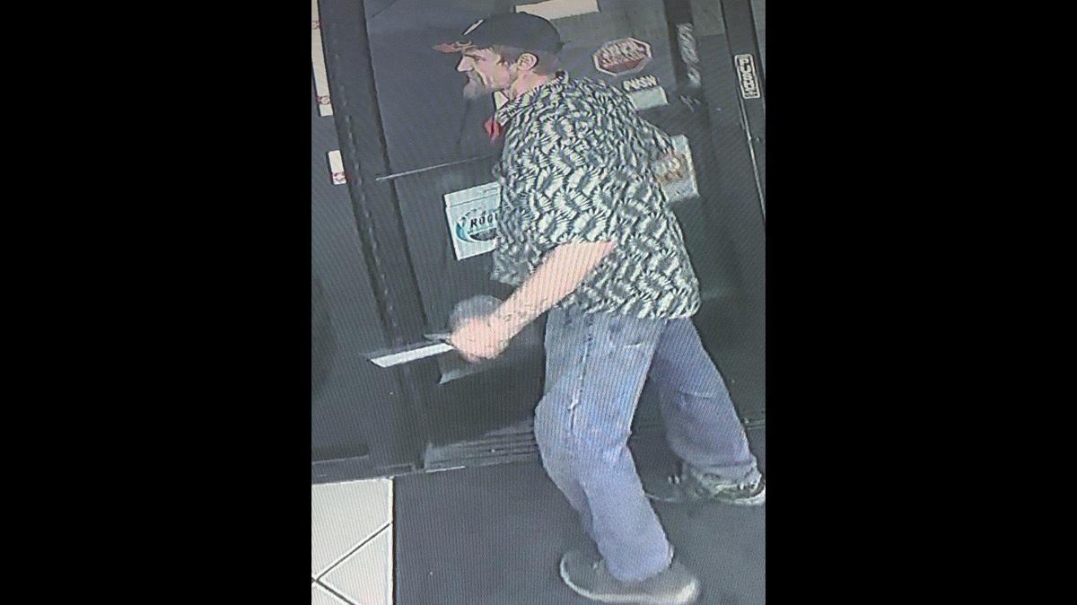 Authorities are looking for a suspect allegedly captured on surveillance video assaulting a victim at a Merced business, according to the Merced Police Department. Image courtesy of Merced Police Department.