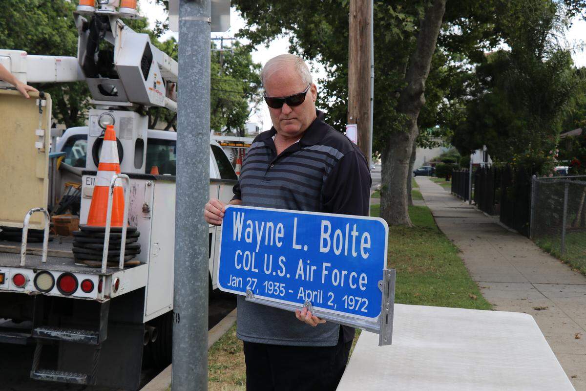 Merced veteran Mark Bolte holds a plaque with his father’s name before it is memorialized along M Street and 12th Street Monday, May 20, 2019. Mark Bolte’s father, Wayne Bolte, was a U.S. Air Force pilot and was killed when his plane was possibly hit and crashed during the Vietnam War.