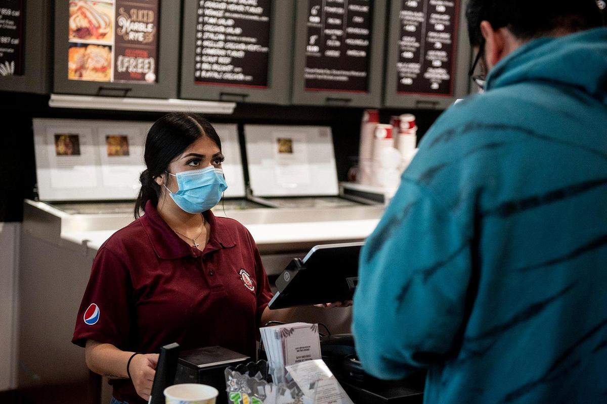 Vivica Avina, 19, of Merced, takes a customer’s order at West Coast Sourdough located at 125 E. Yosemite Ave Suite C, in Merced, Calif., on Thursday, Jan 19, 2023.