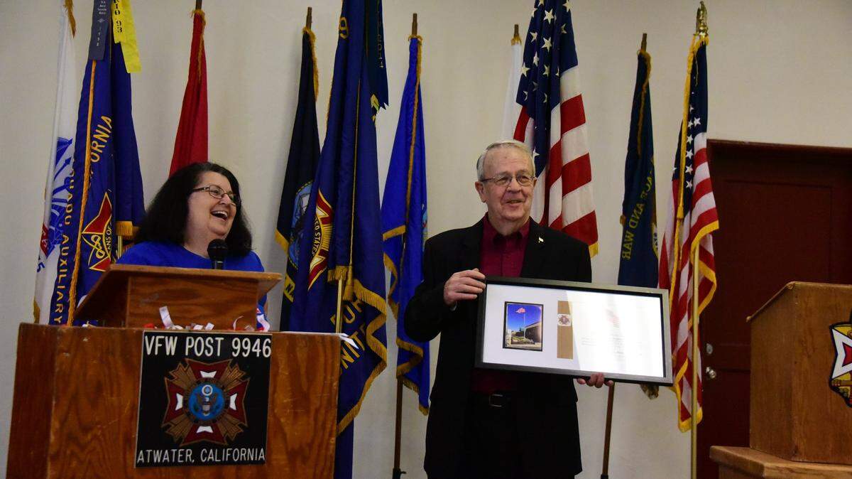 Master Sgt. Gary Brice holds a plaque of recognition that was given to Merced Supervisor Daron McDaniel for proudly displaying his American flag daily at his home. The Victor S. Machado Veterans of Foreign Wars Post 9946 & Auxiliary celebrated their 70th anniversary in Atwater, Calif. on Saturday, April 6, 2019.