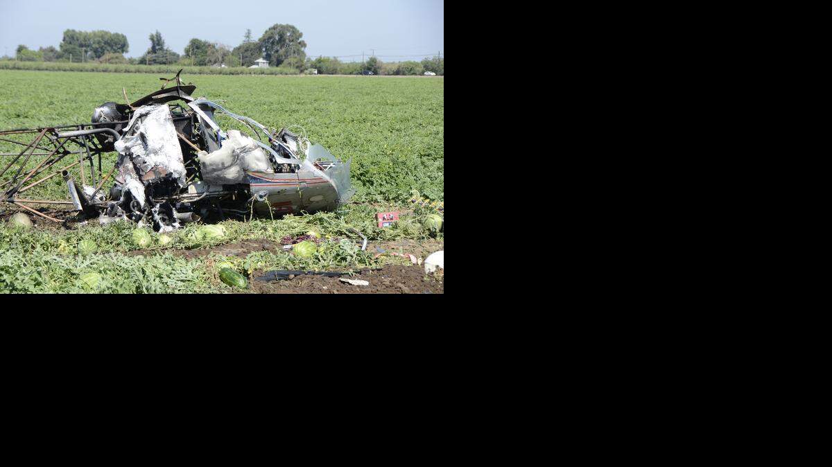 The mangled wreckage of a crashed helicopter crop duster could be seen on Friday (7-18-14), in Merced on Lopes Ave. and Thornton Rd. in a watermelon field.
