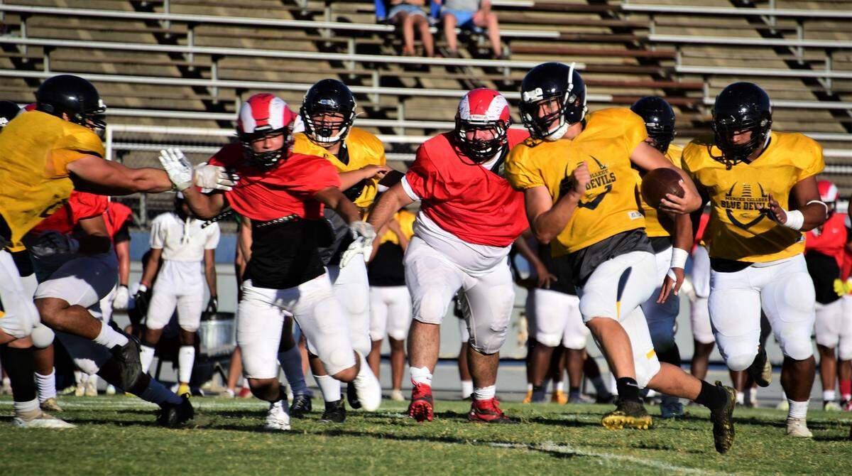 Merced College freshman running back Payton Johnson runs the ball against Fresno City during a scrimmage on Thursday, Aug. 25, 2022 at Stadium ’76.