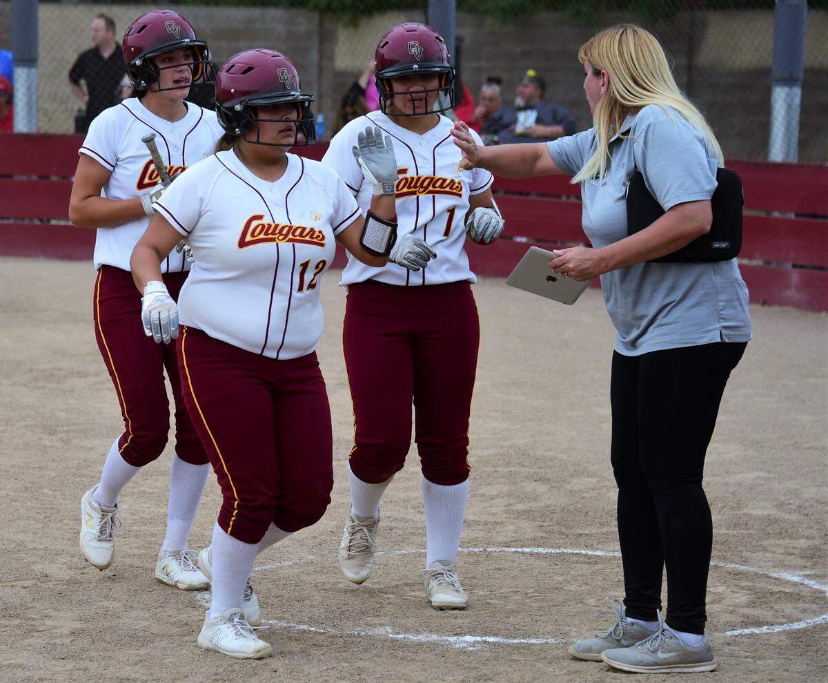 From left to right, Golden Valley’s Marissa Bertuccio, Maddie Martinez and Vanessa Saltos are all greeted by Cougars assistant coach Jennifer Bertuccio after scoring on a triple by Maddy Stokes during GV’s 7-0 win over East Union on Wednesday afternoon at Golden Valley High.