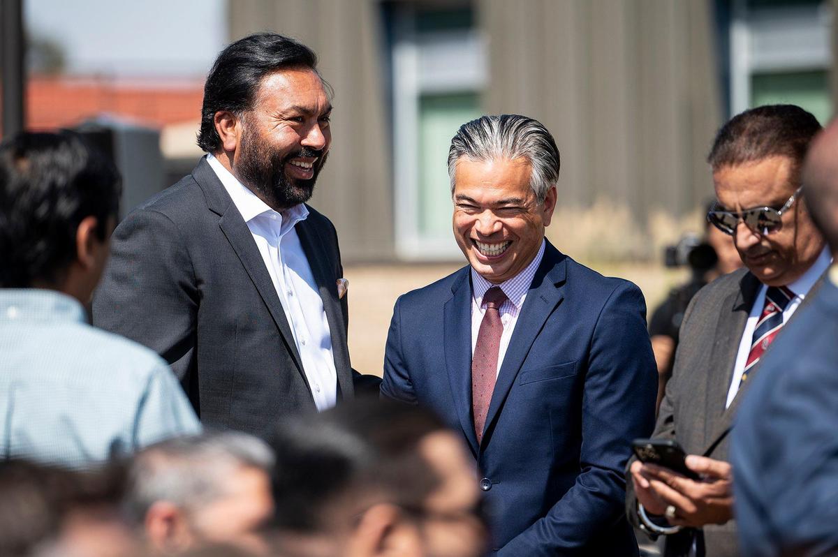 Raj Kahlon, left, speaks with California Attorney General Rob Bonta, right, prior to a ribbon cutting ceremony for the Raj Kahlon Agriculture and Industrial Technology Complex on the Merced College campus in Merced, Calif., on Thursday, Sept. 15, 2022. According to Merced College, the new 29,000- square-foot facility is state of the art and will allow the college to train additional students for jobs in agriculture as well as industrial technology and other workforce programs.